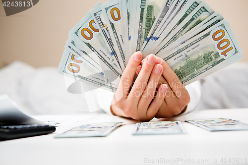 Image of Hands counting money, close up