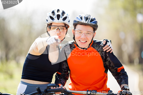 Image of Portrait of couple on bicycles