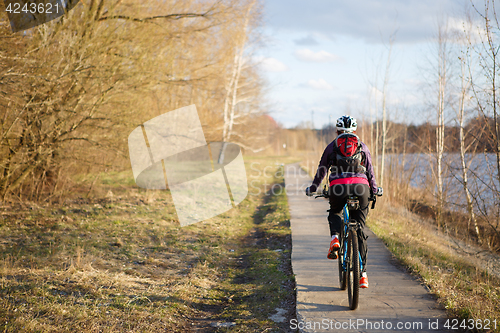 Image of Park and girl on bicycle