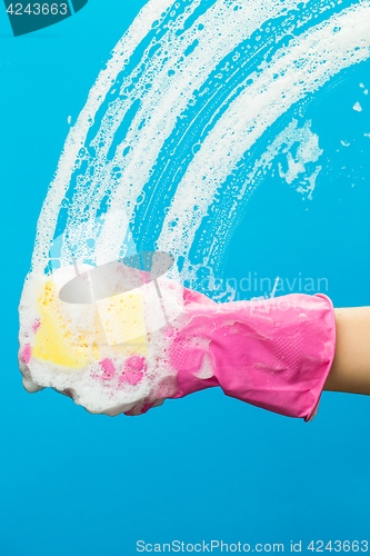 Image of Man with glove cleaning window