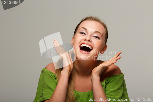 Image of Satisfied girl in green dress