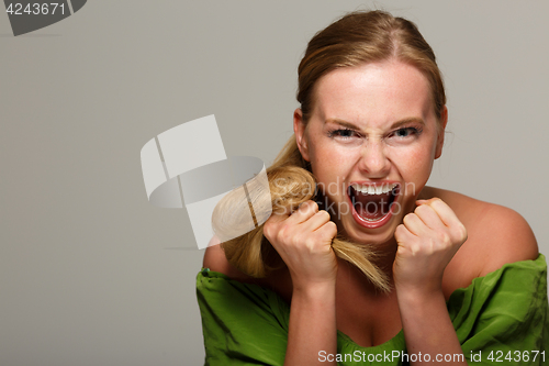 Image of Screaming model with bare shoulders