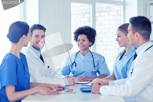 Image of group of happy doctors meeting at hospital office