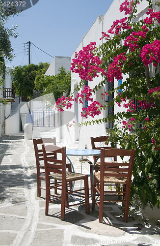 Image of cafe taverna classic greek table chairs greek islands