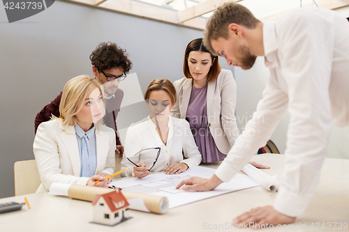 Image of business team discussing house project at office