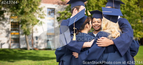 Image of happy students or bachelors hugging