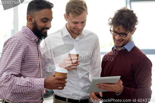 Image of business team with tablet pc and coffee at office