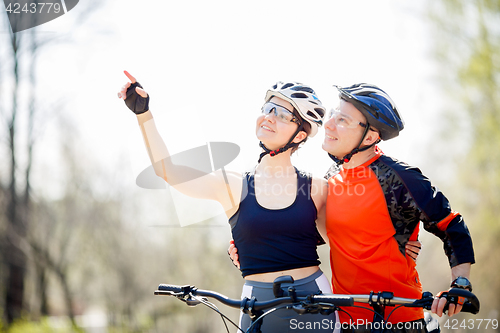 Image of Couple in helmets with bicycles