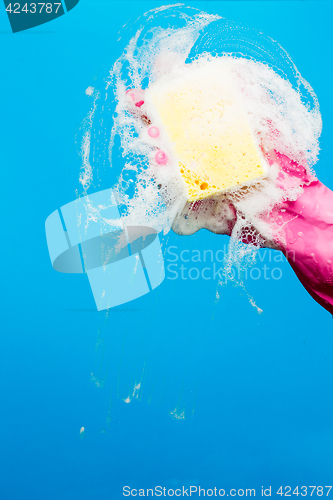 Image of Man with sponge washes window