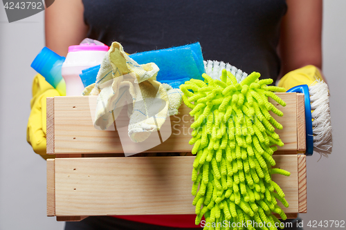 Image of Man holding box of rags