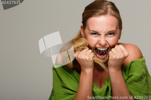 Image of Screaming model in green dress