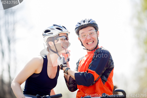 Image of Bicyclists wear helmets in park