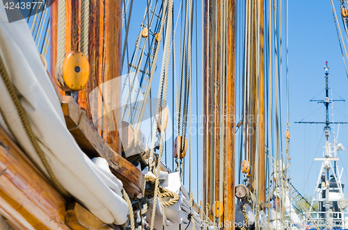 Image of Folded sail and mast on an old sailboat