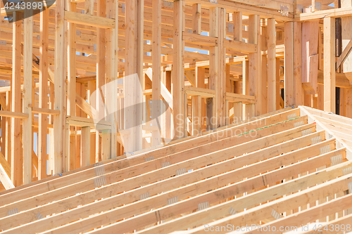 Image of Wood Home Framing Abstract At Construction Site.