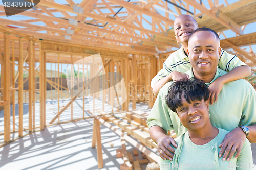 Image of Young African American Family On Site Inside Their New Home Cons