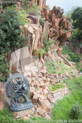 Image of Tantric Deities statue in Ritual Embrace located in a mountain g