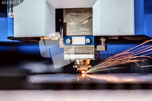 Image of CNC Laser cutting of metal, modern industrial technology.