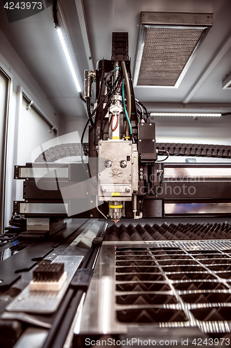 Image of CNC Laser cutting of metal, modern industrial technology.