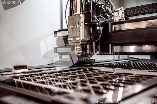 Image of CNC Laser cutting of metal, modern industrial technology.