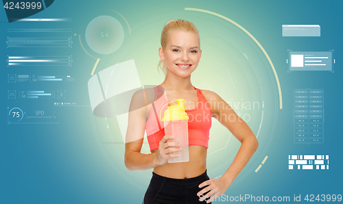 Image of smiling sporty woman with shaker bottle