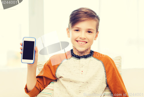 Image of smiling boy with smartphone at home