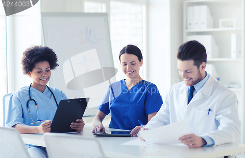 Image of group of happy doctors meeting at hospital office