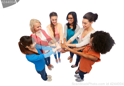 Image of international group of women with hands together