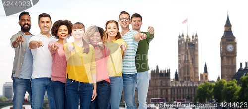 Image of international group of people pointing on you