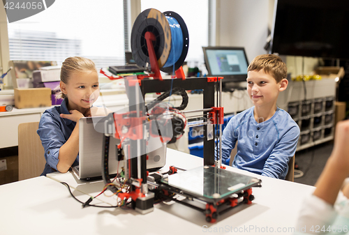 Image of happy children with 3d printer at robotics school