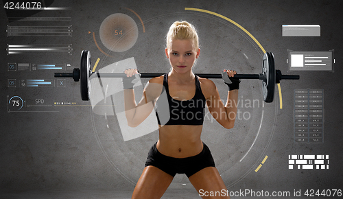 Image of sporty young woman flexing muscles with barbell