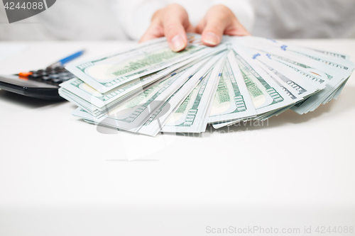 Image of Hands with money