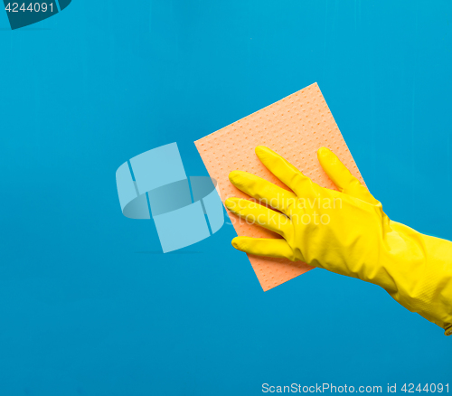 Image of Man wiping window with rag