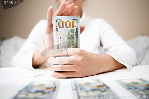 Image of Woman hands holding money