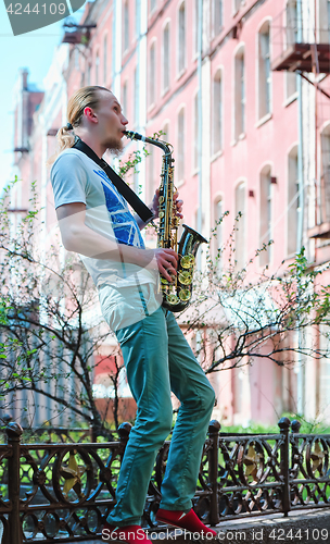 Image of Young Man Plays Sax