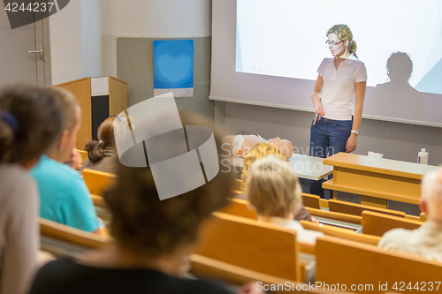 Image of Instructor teaching first aid cardiopulmonary resuscitation workshop.