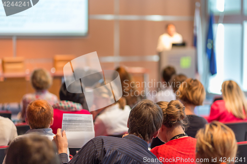 Image of Speaker giving presentation on business conference.