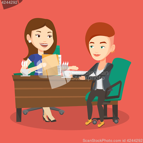 Image of Two businesswomen during business meeting.