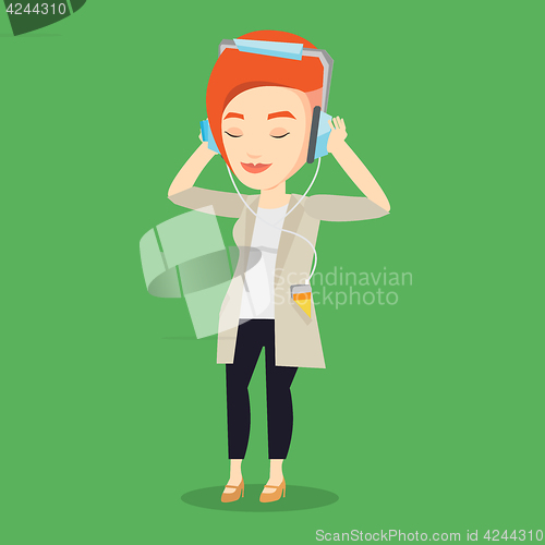 Image of Young woman in headphones listening to music.