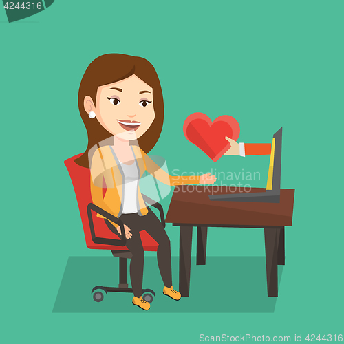 Image of Young woman dating online using laptop.