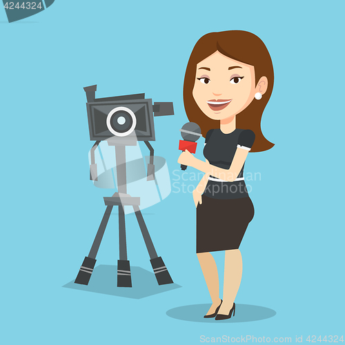 Image of TV reporter with microphone and camera.