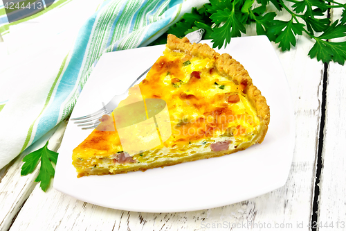 Image of Quiche with pumpkin and bacon in plate on light board