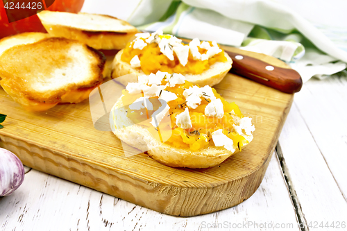 Image of Bruschetta with pumpkin feta on light board