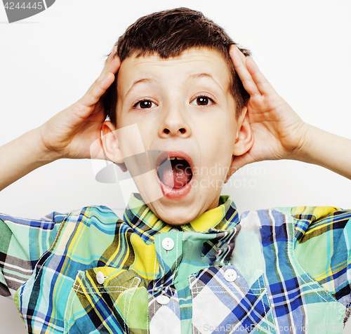 Image of young pretty little cute boy kid wondering, posing emotional face isolated on white background, gesture happy smiling closeup, lifestyle people concept