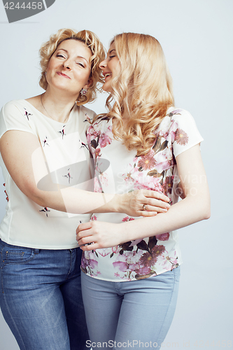 Image of mother with daughter together posing happy smiling isolated on white background with copyspace, lifestyle people concept closeup