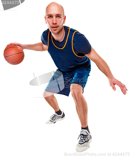 Image of Full length portrait of a basketball player with ball