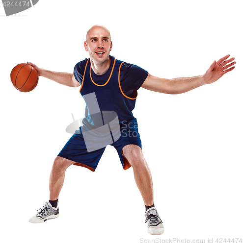 Image of Full length portrait of a basketball player with ball