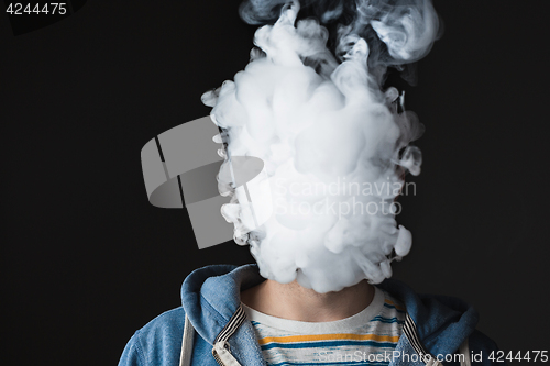 Image of The face of vaping young man