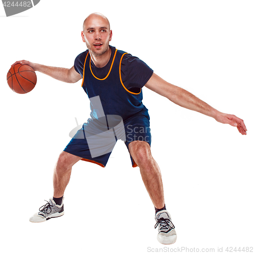 Image of Full length portrait of a basketball player with ball