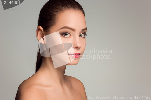 Image of Beautiful woman face portrait close up on blue