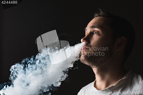 Image of The face of vaping young man